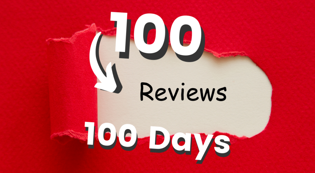 red paper reaped back exposing the words 100 reviews in 100 days the fast track to reviews