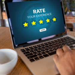 laptop showing customer looking at a 5-star rating