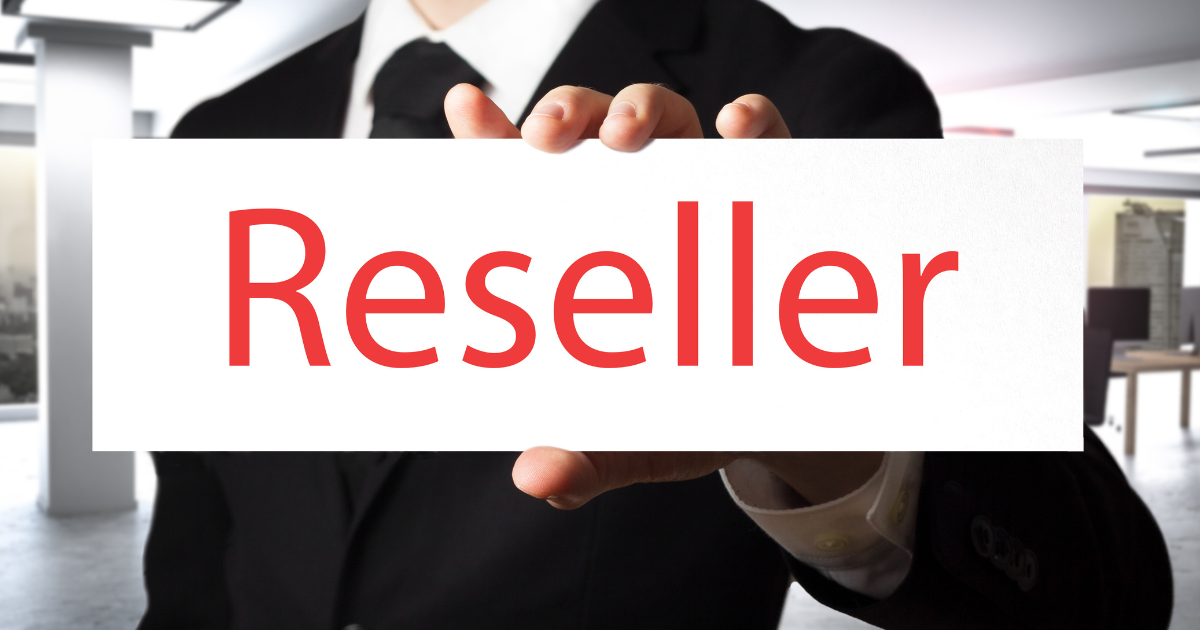 businessman in suit holding a sign saying reseller