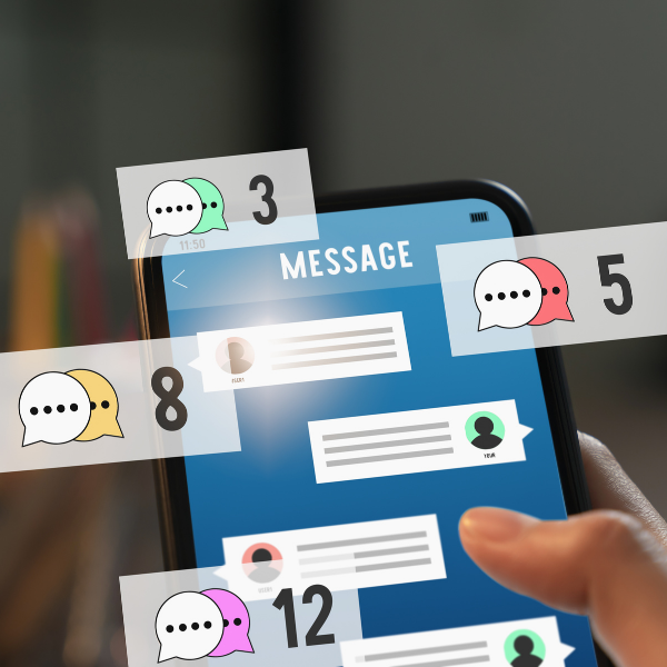 person holding phone looking at multi-channel messages