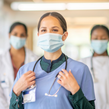 healthcare professionals walking down hospital hall - review management for healthcare